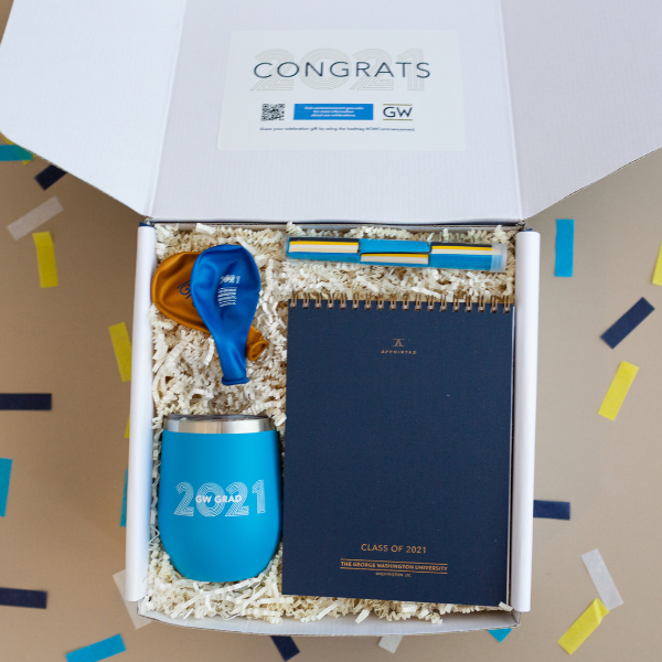 graduation gift with branded notebook mug balloons and confetti