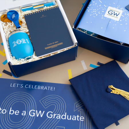 gw university graduation gifts with banner and graduation cap