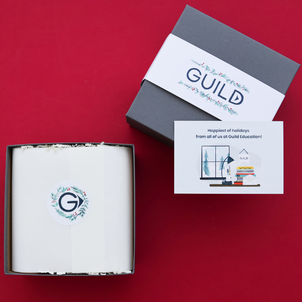 guild education client gift boxes on red background