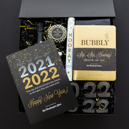the washington post branded black and gold products inside gift box