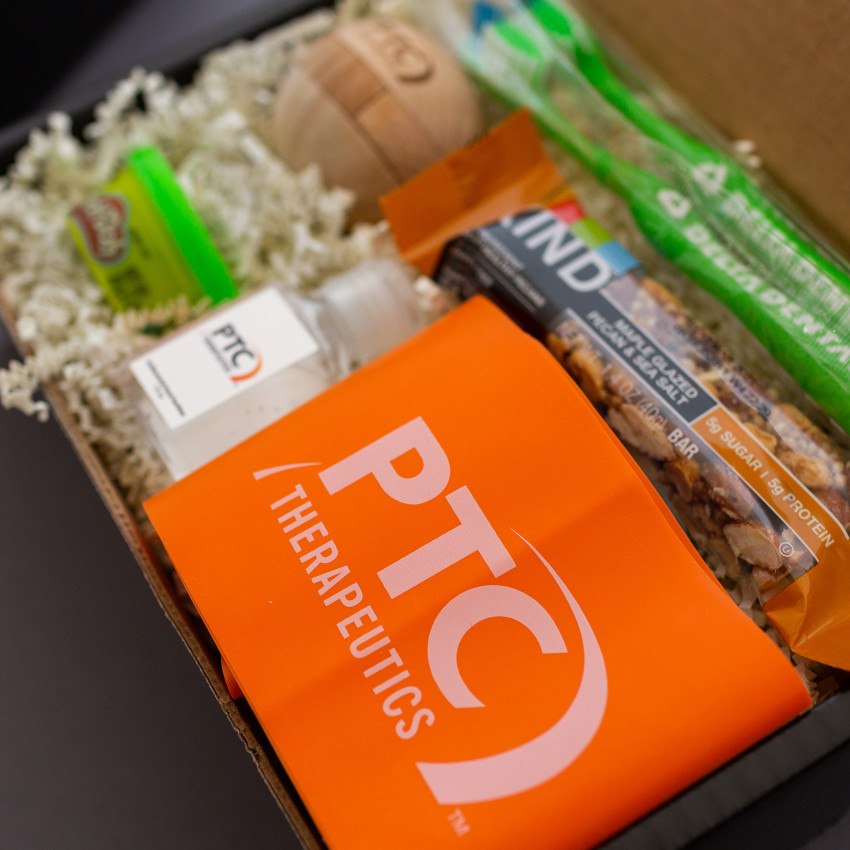 ptc therapeutics branded orange exercise band inside gift box