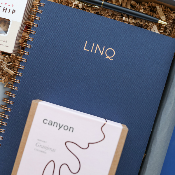 linq logo on blue notebook