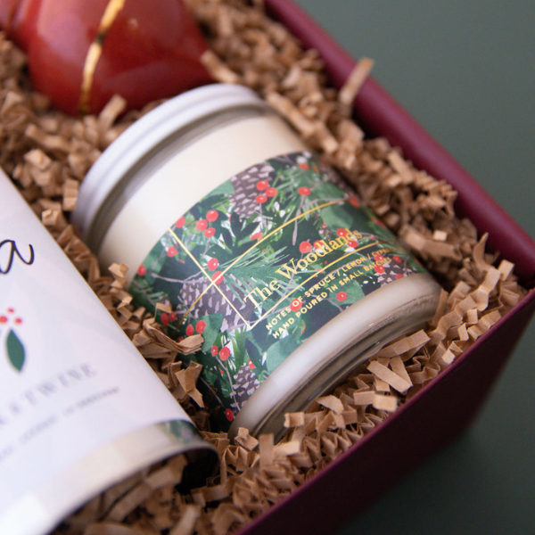 custom holiday gift box with candle and ornament
