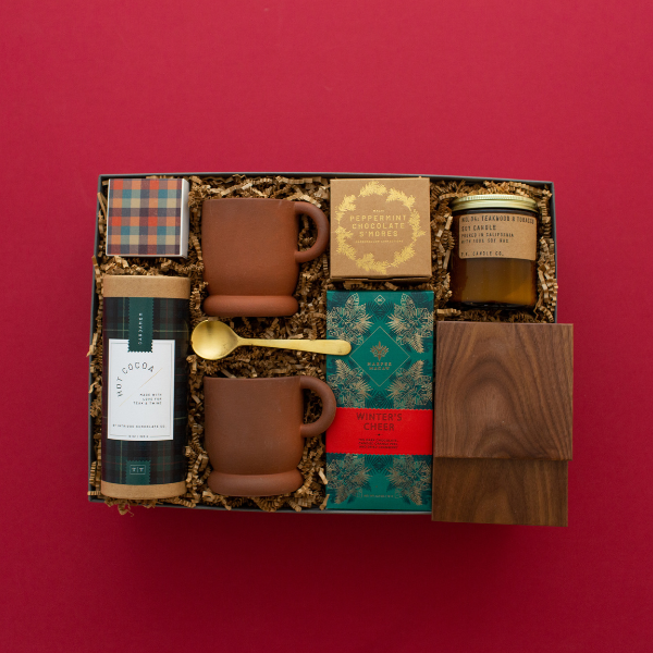 large holiday gift with mugs and hot chocolate
